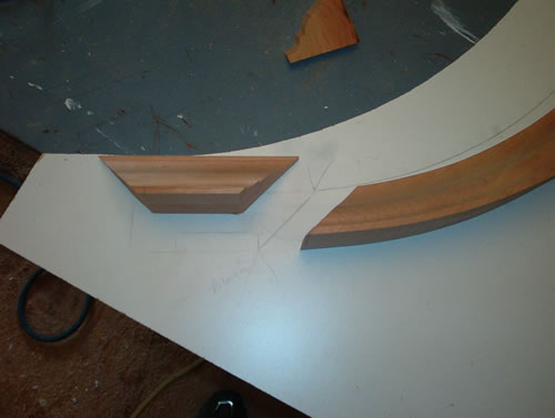 Cutting crown molding from a template.